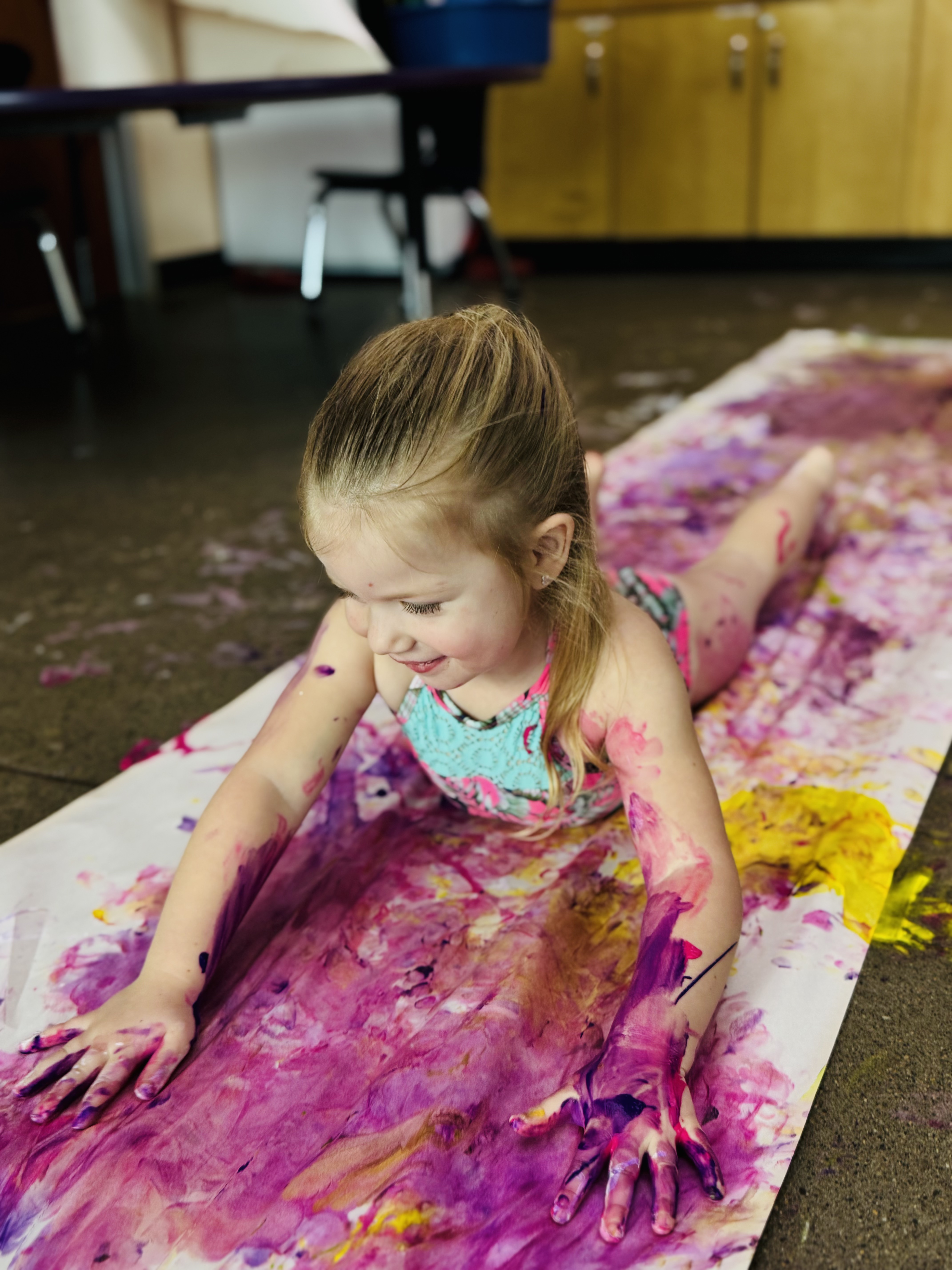 Girl painting with body