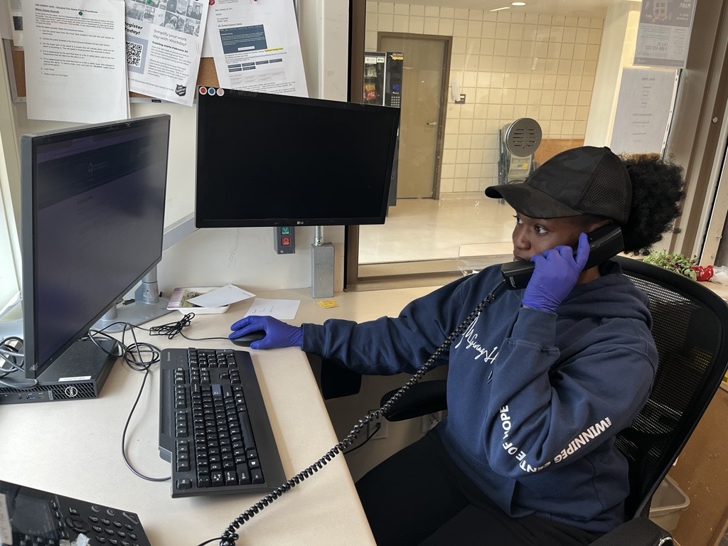 An employee at WCOH receiving a telephone call