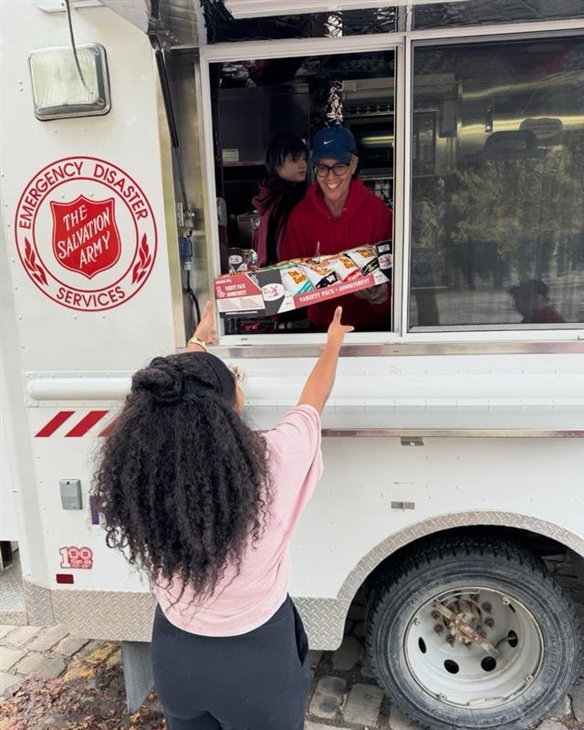 WCOH team at the community outreach giving out snacks and food