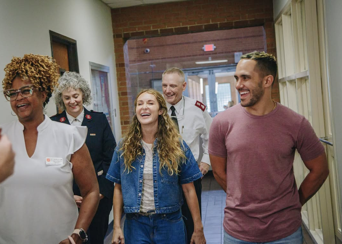 A group of team members smiling