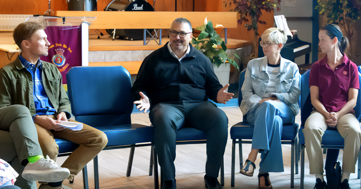 People sitting on chairs talking
