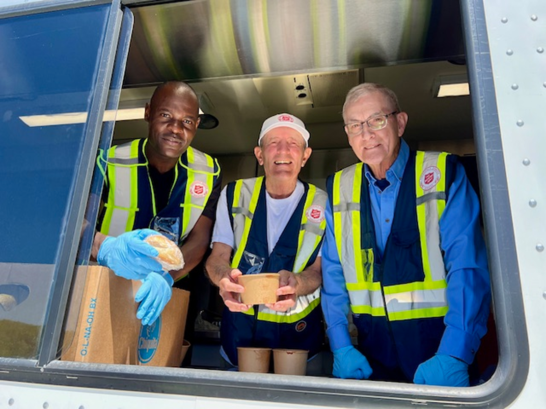 Volunteers smiling at the camera