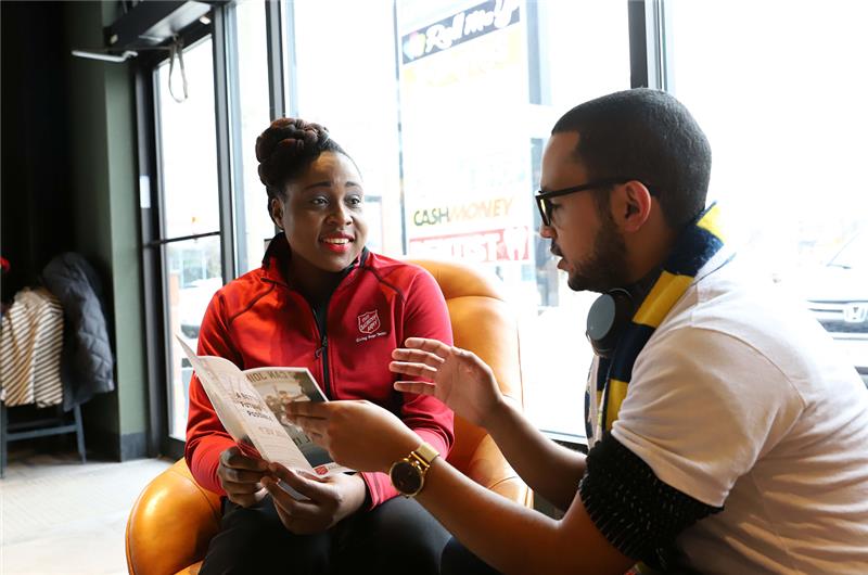 A client being briefed on available programs