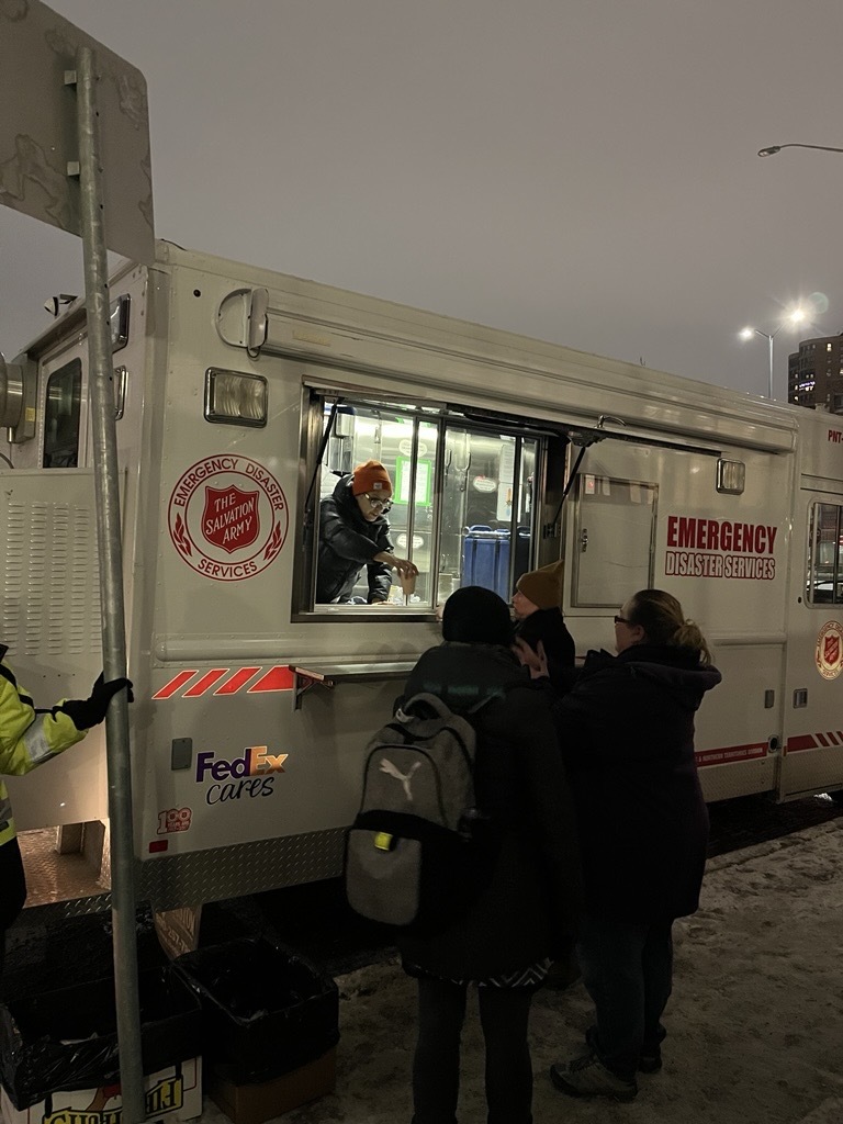 Emergency Vehicle distributing coffee. 